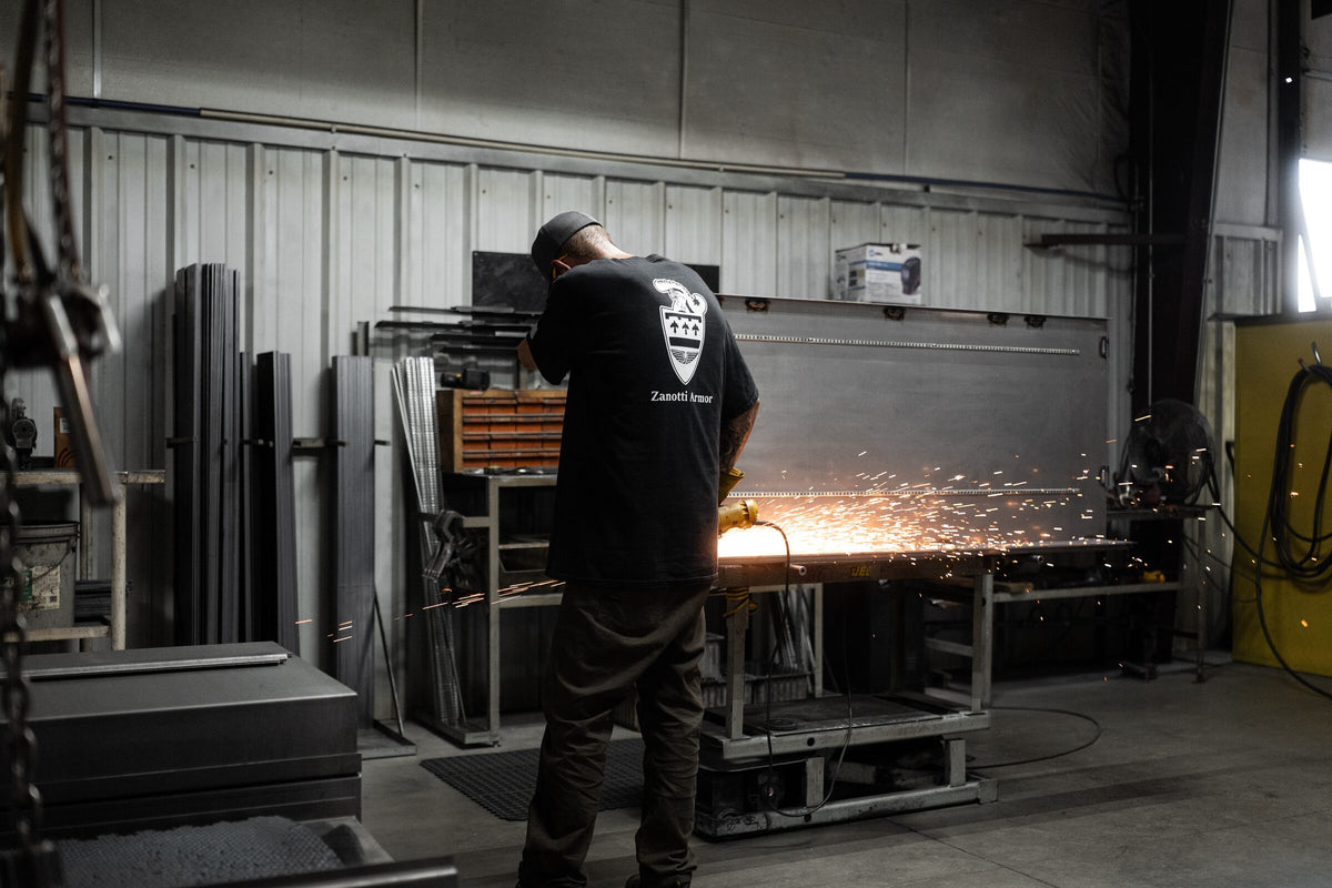 Grinding sparks off a safe panel