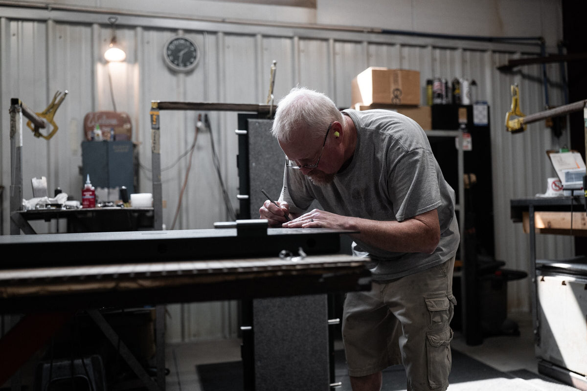 Craftsman marking a steel panel